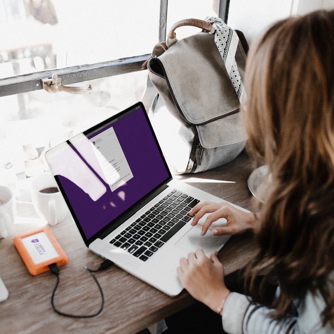 female student and laptop crown college tuition aid