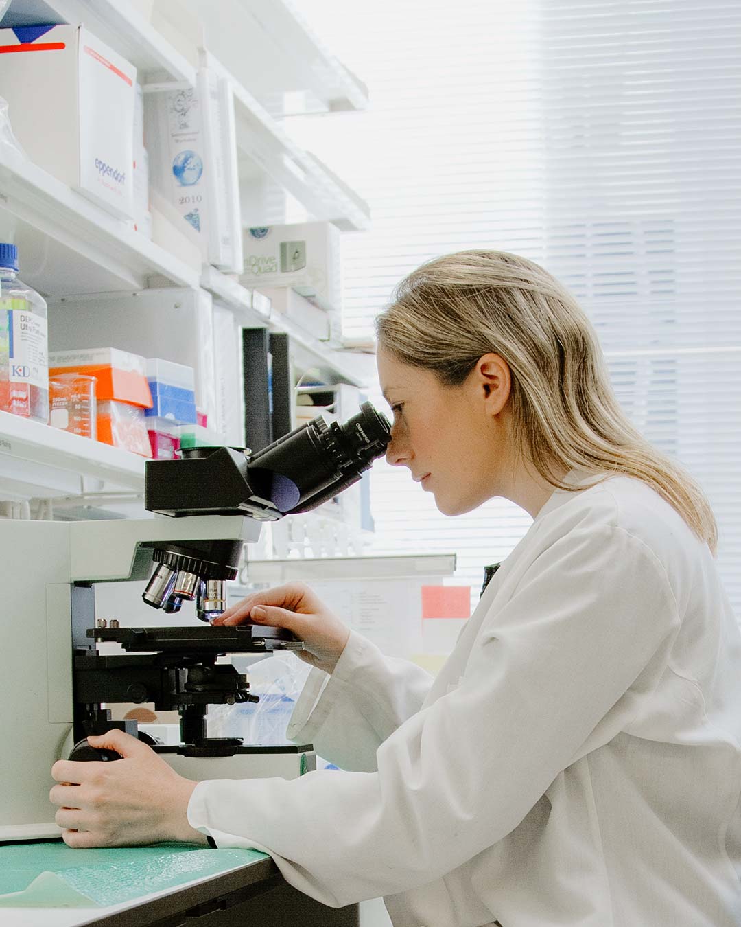 female doing science research for christian biologist degrees