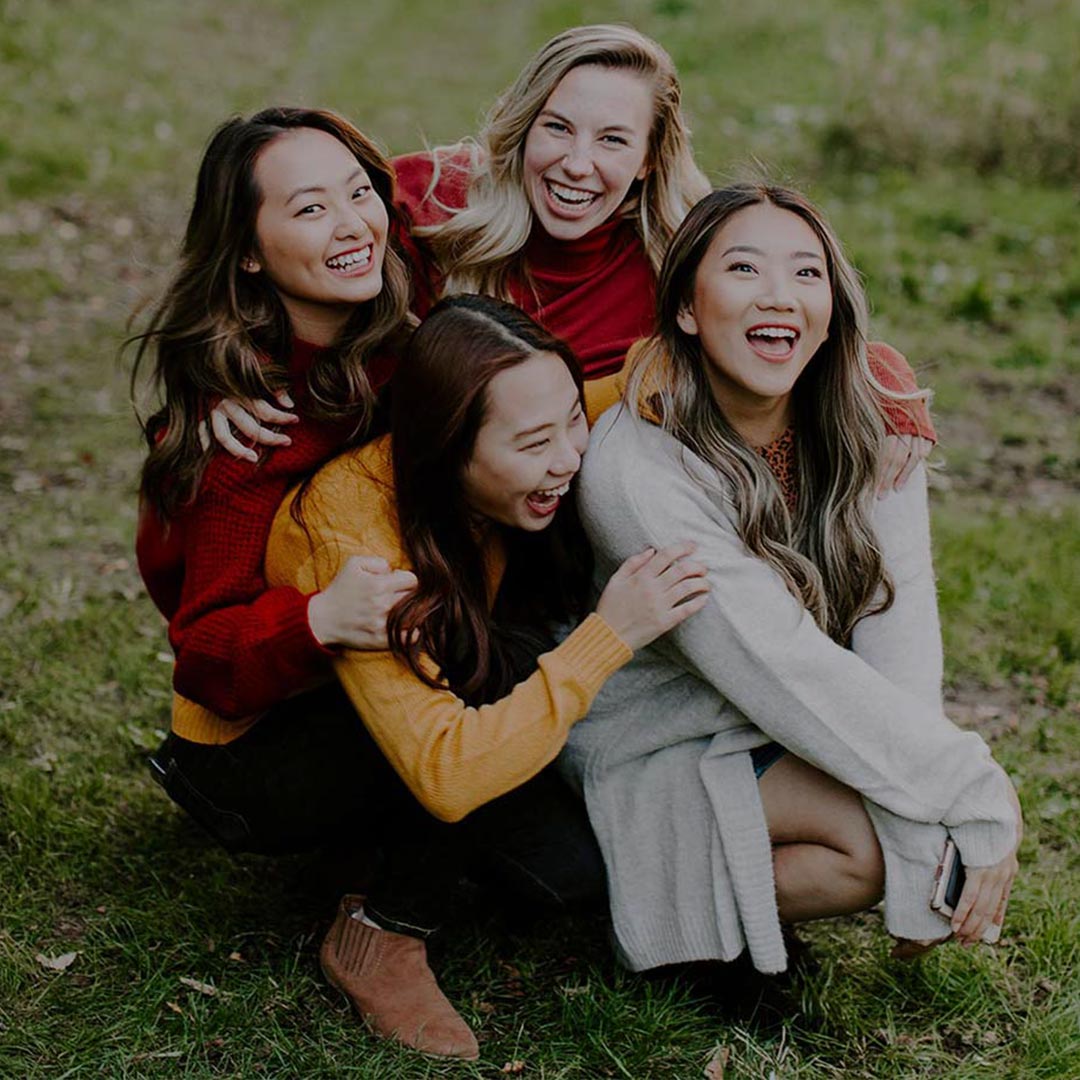 female students laughing with one another in christian courses