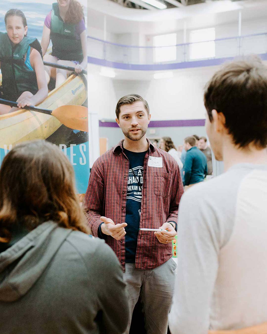 male speaking to students for christian college degrees