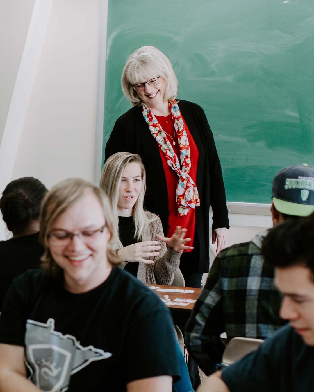professor working with students private christian college