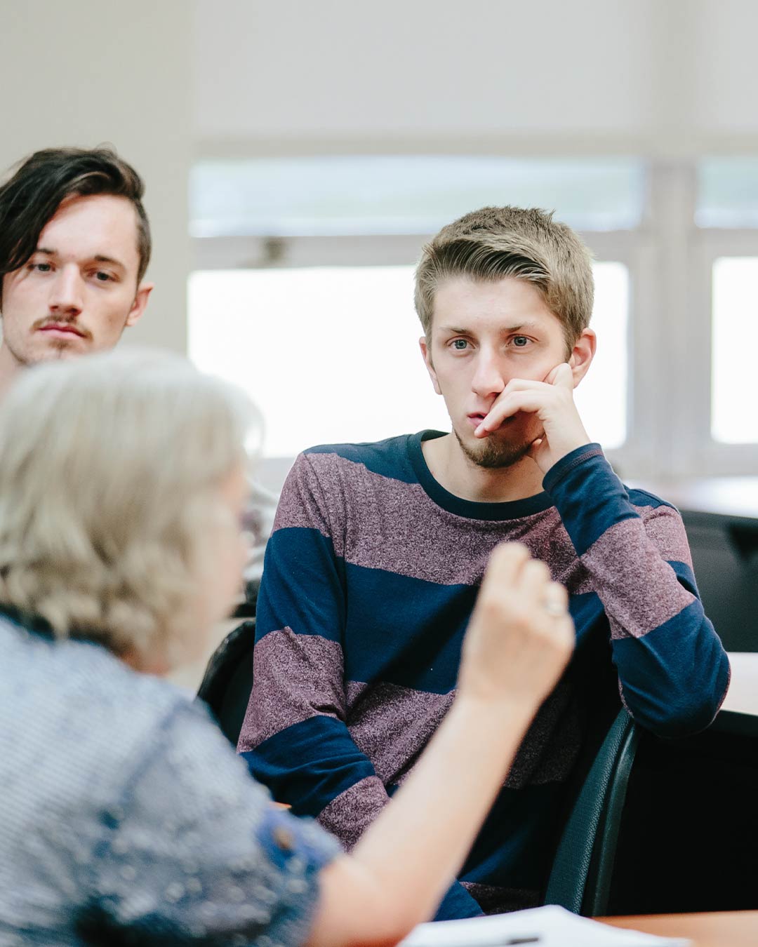 student learning from psychology professor in christian psychology degree