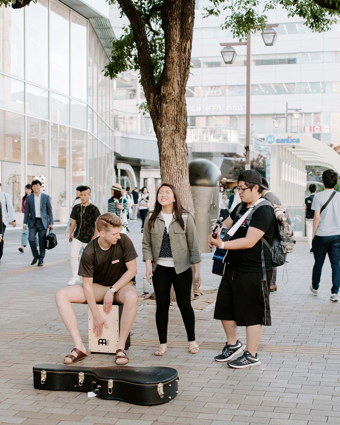 students playing music in japenese streets for bible study programs