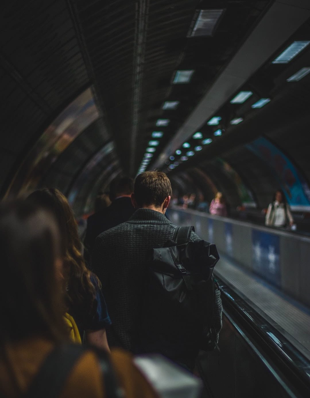 man on moving sidewalk college online degree programs