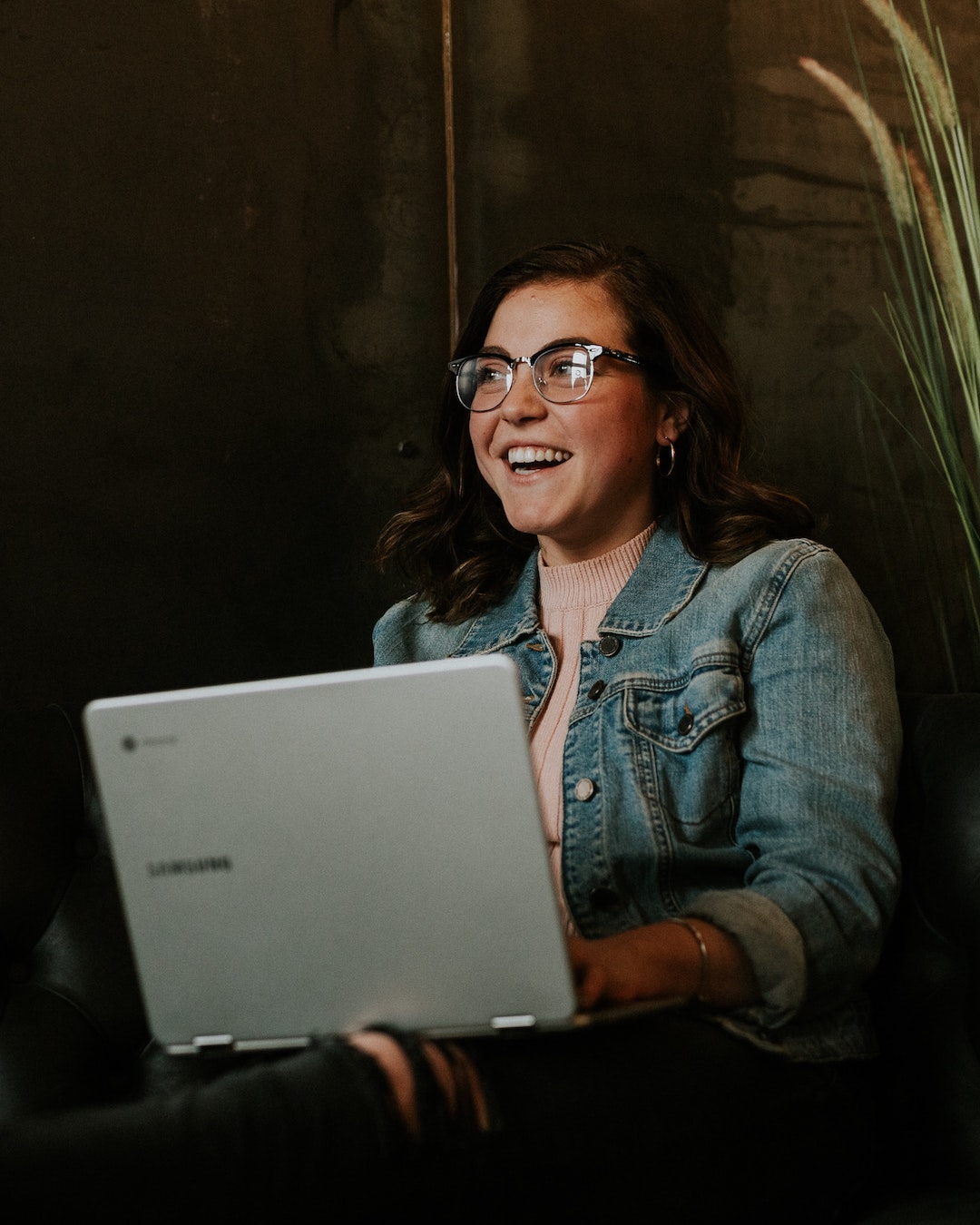 smiling female student with her laptop at private christian college